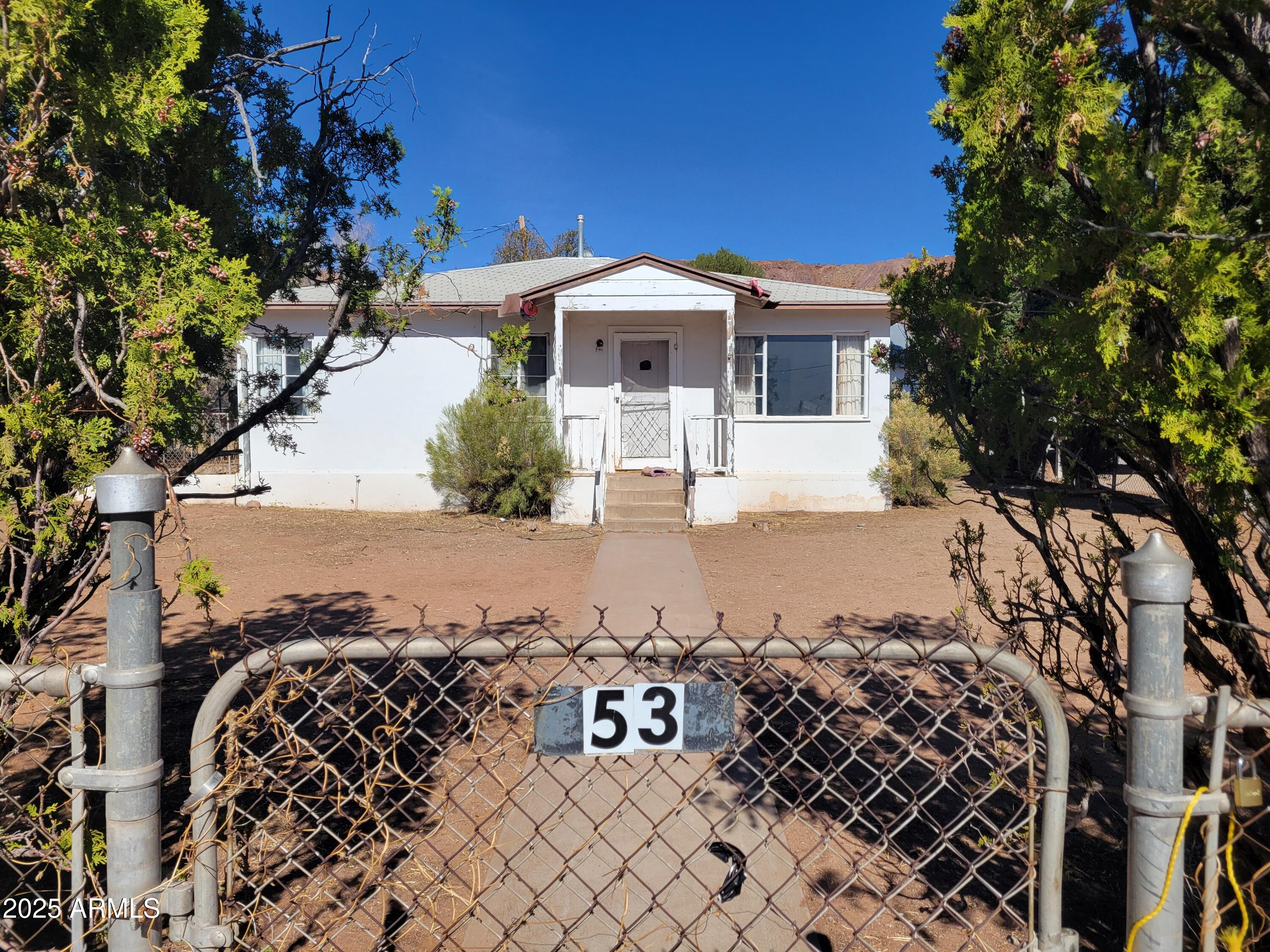 53 Spray Avenue Bisbee, AZ 85603 - Photo 2 of 21 a front view of a house with a yard