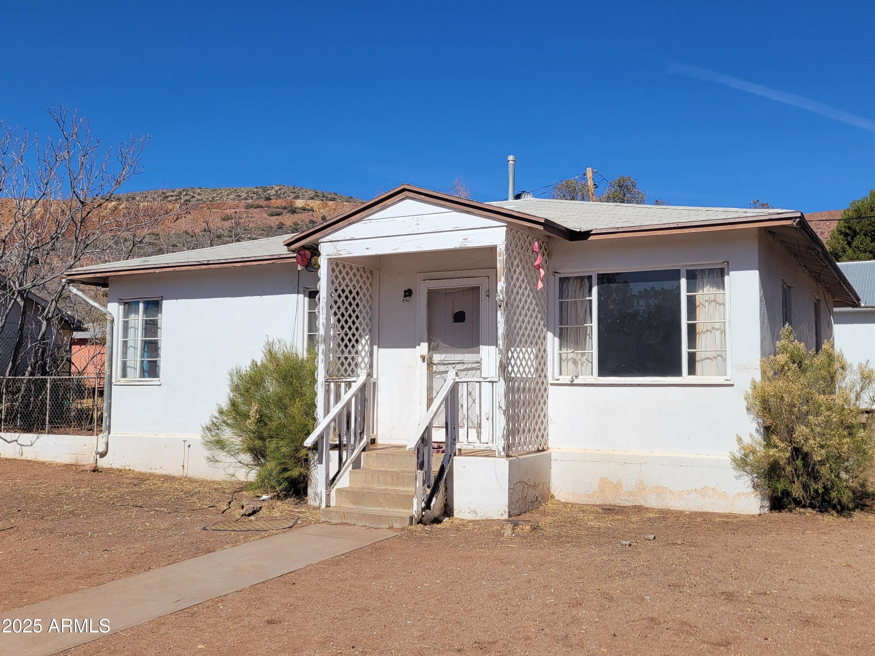 53 Spray Avenue Bisbee, AZ 85603 - Photo 21 of 21 a view of a house with a patio