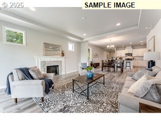 563 East Cleveland Street Carlton, OR 97111 - Photo 4 of 7 a living room with furniture and a fireplace