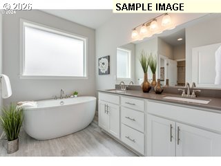 563 East Cleveland Street Carlton, OR 97111 - Photo 7 of 7 a bathroom with a tub sink and mirror