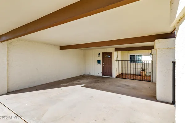 a view of a big room with wooden floor and stairs