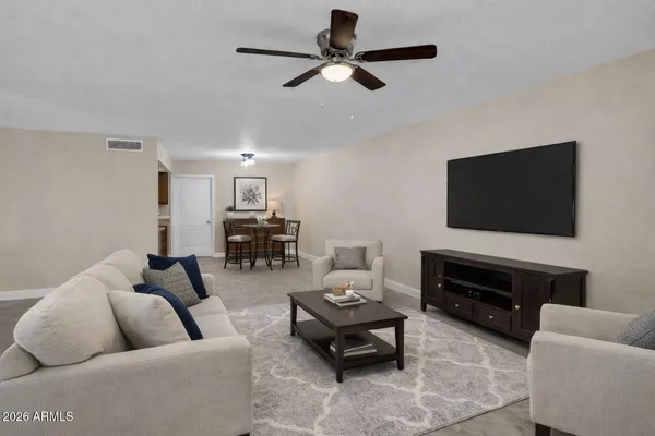 a living room with furniture and a flat screen tv