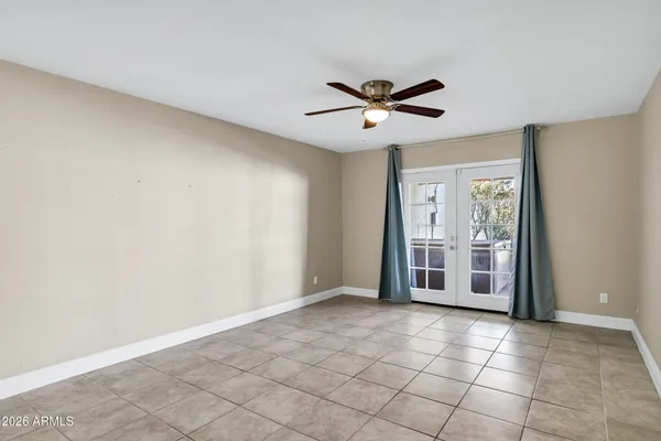 a view of an empty room with a window