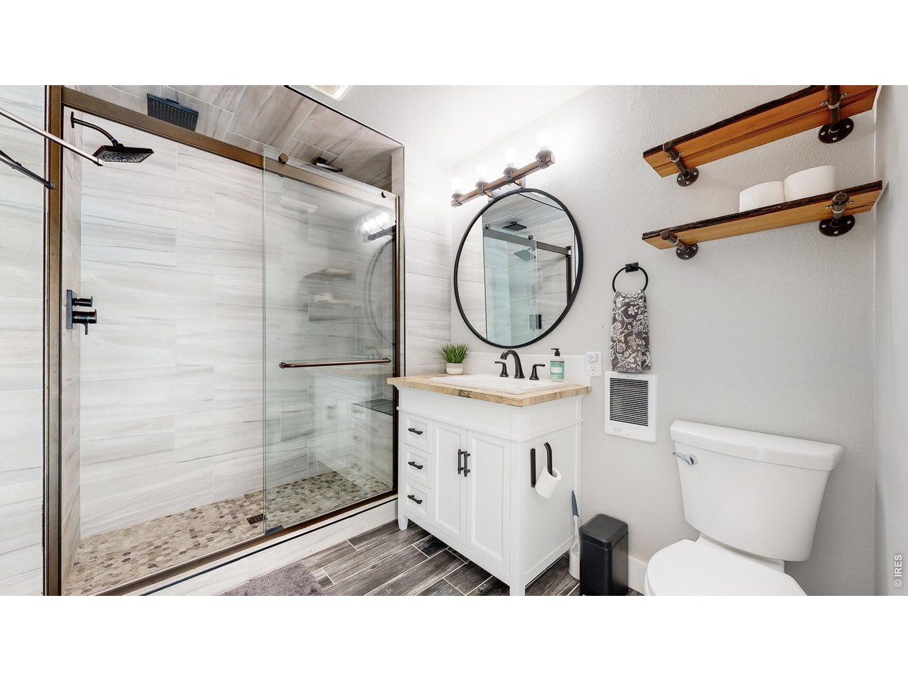 1268 Spring Valley Road Bellvue, CO 80512 - Photo 15 of 33 a bathroom with a toilet a sink and a mirror