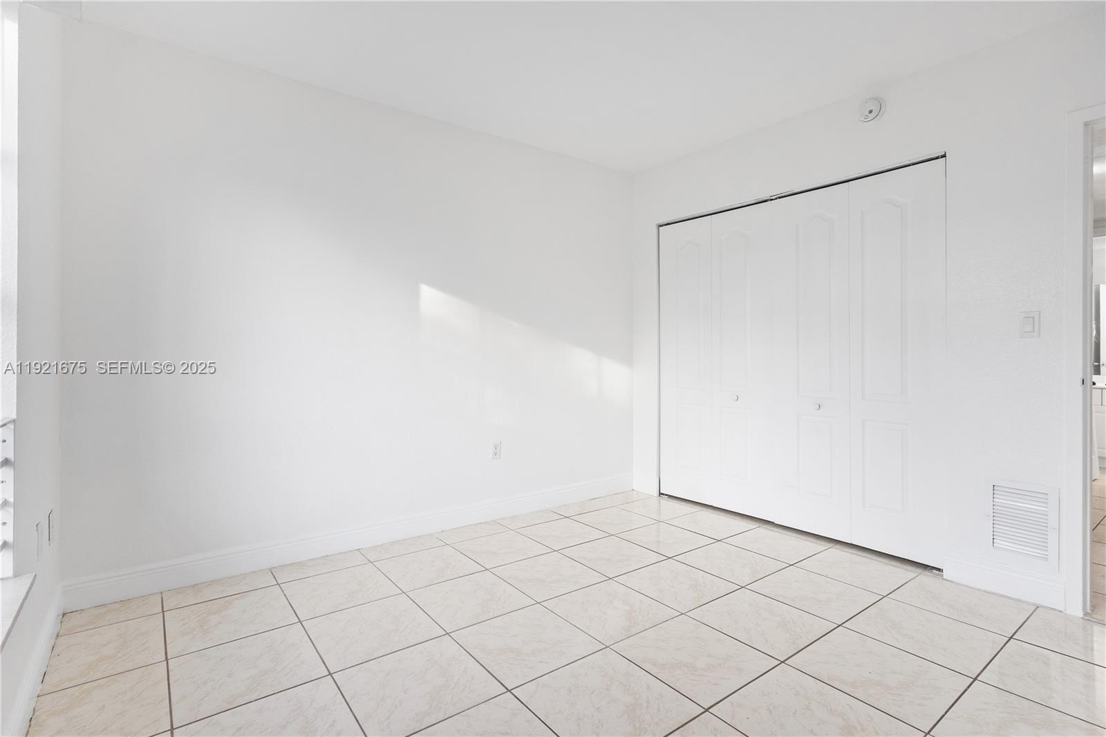 5102 Northwest 79th Avenue, Unit 304 Doral, FL 33166 - Photo 19 of 25 a view of an empty room