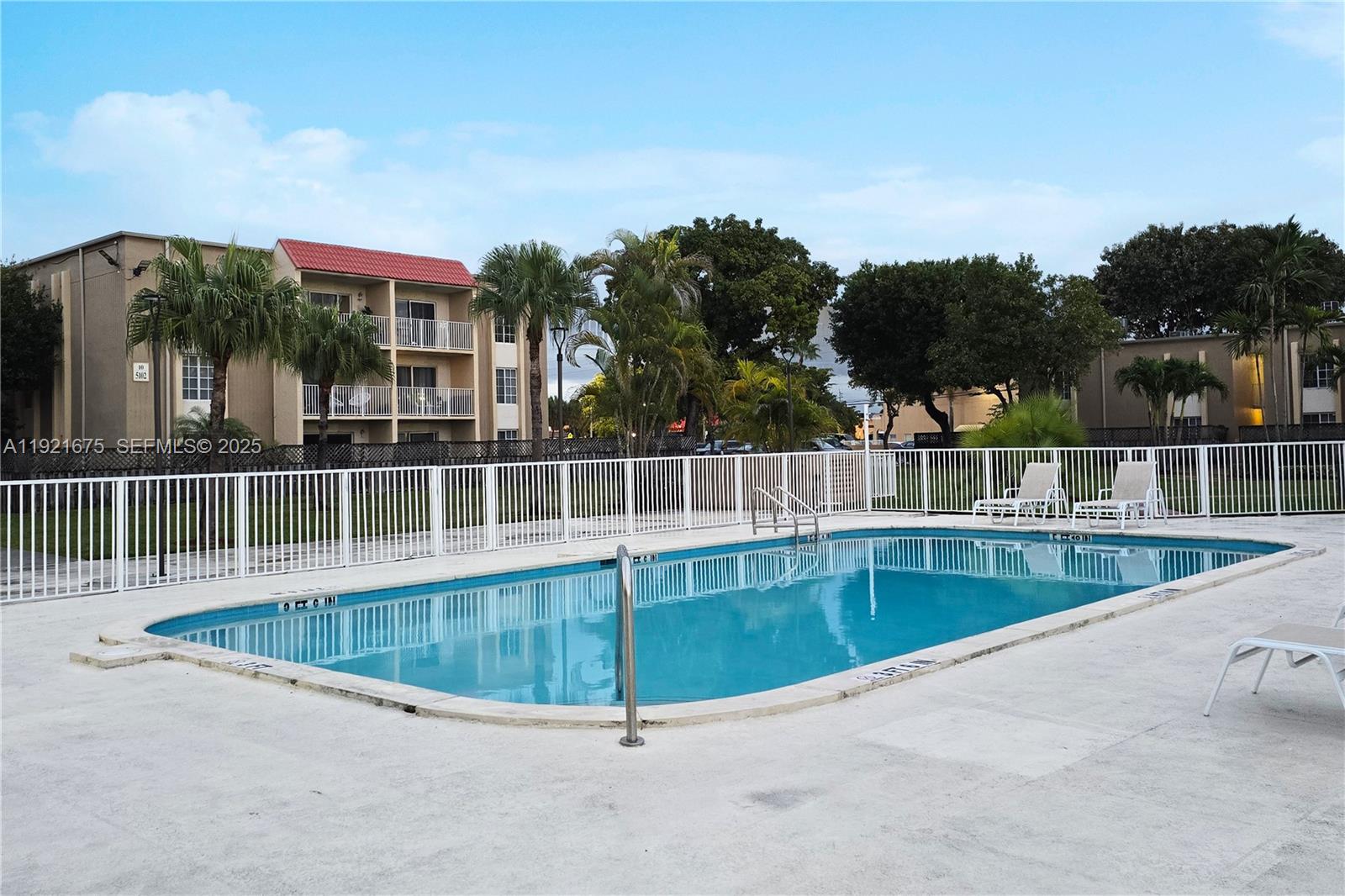 5102 Northwest 79th Avenue, Unit 304 Doral, FL 33166 - Photo 3 of 25 swimming pool view with a seating space and a garden view
