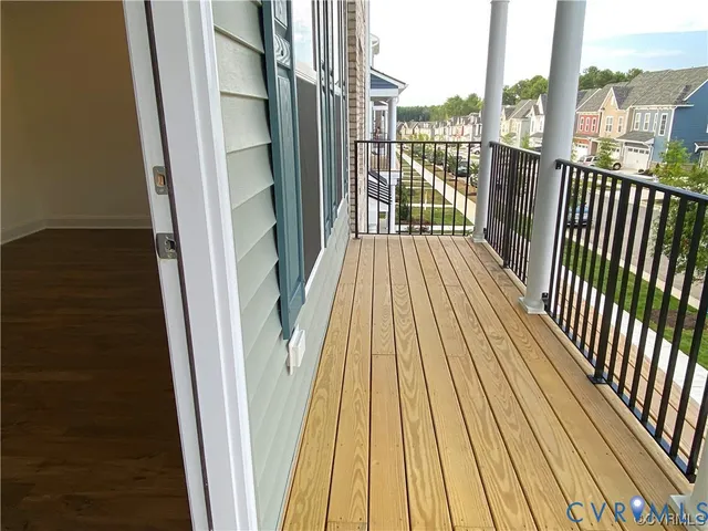 a view of balcony with wooden floor