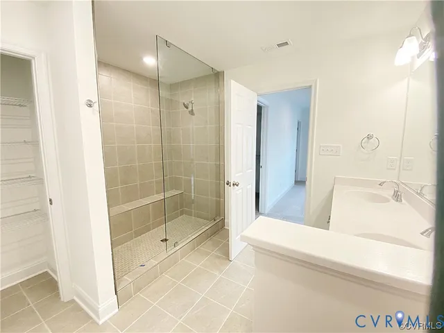 a bathroom with a tub and shower