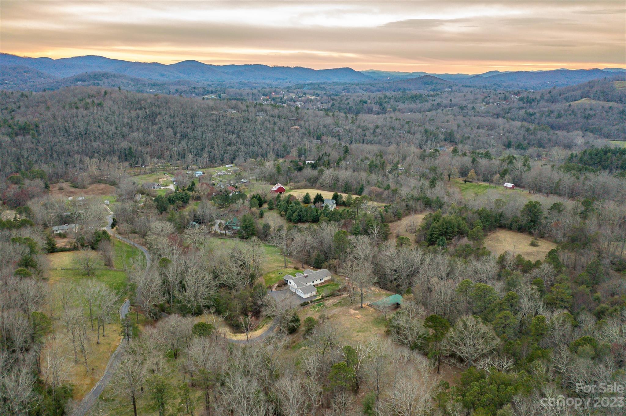 36 Wild Wind Trail Fairview, NC 28730 - Photo 1 of 33 a view of a mountain in the distance field