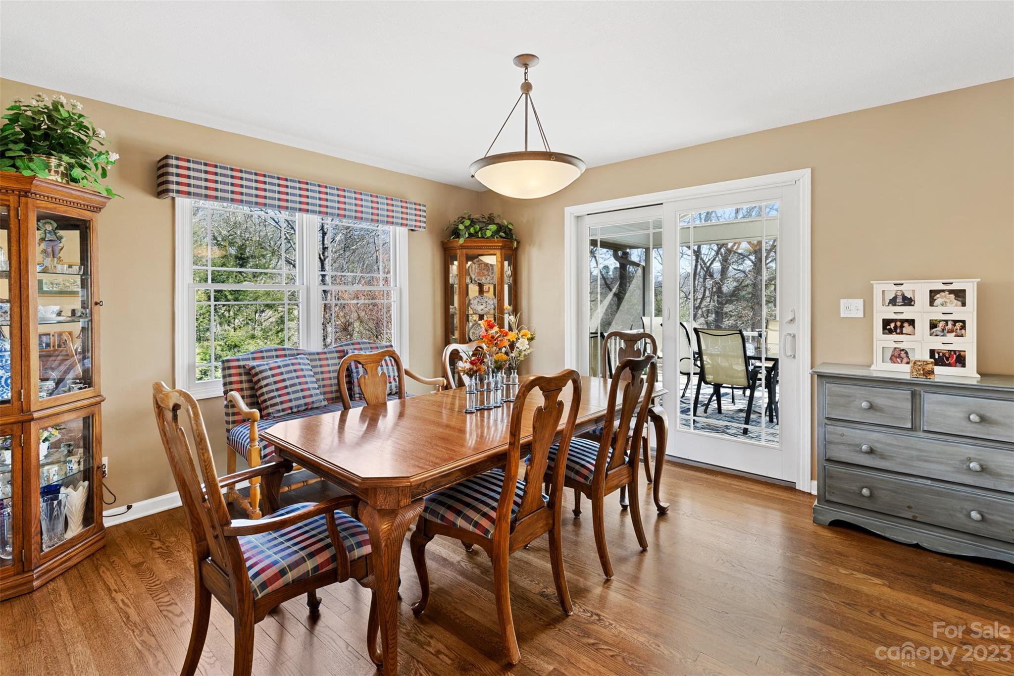 36 Wild Wind Trail Fairview, NC 28730 - Photo 11 of 33 a view of a dining room with furniture window and wooden floor