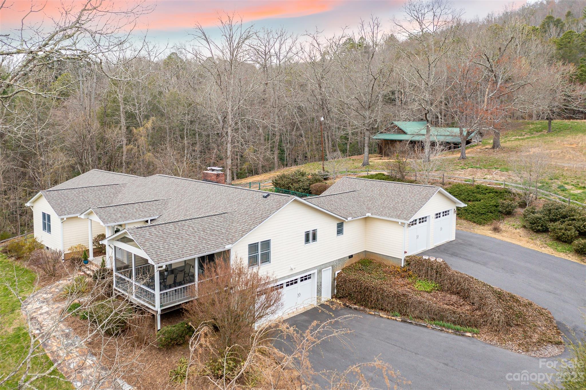 36 Wild Wind Trail Fairview, NC 28730 - Photo 3 of 33 a aerial view of a house with a yard and large trees