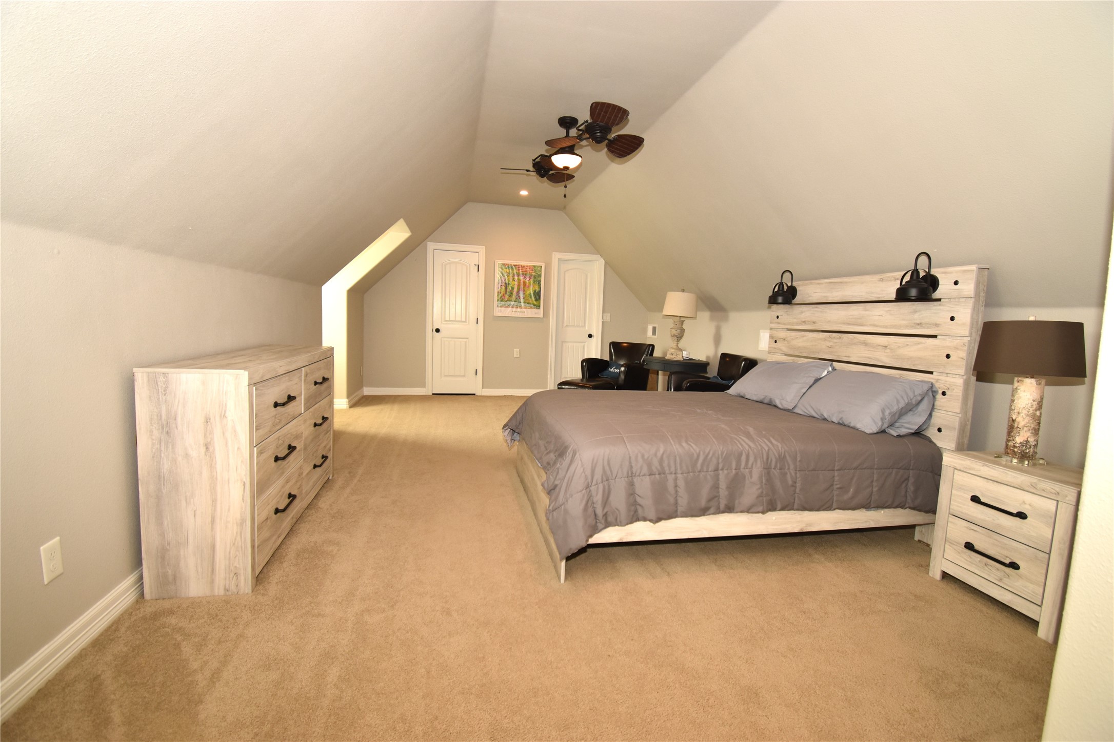 11620 Ridgecrest Beaumont, TX 77705 - Photo 12 of 20 a spacious bedroom with a bed and a chandelier