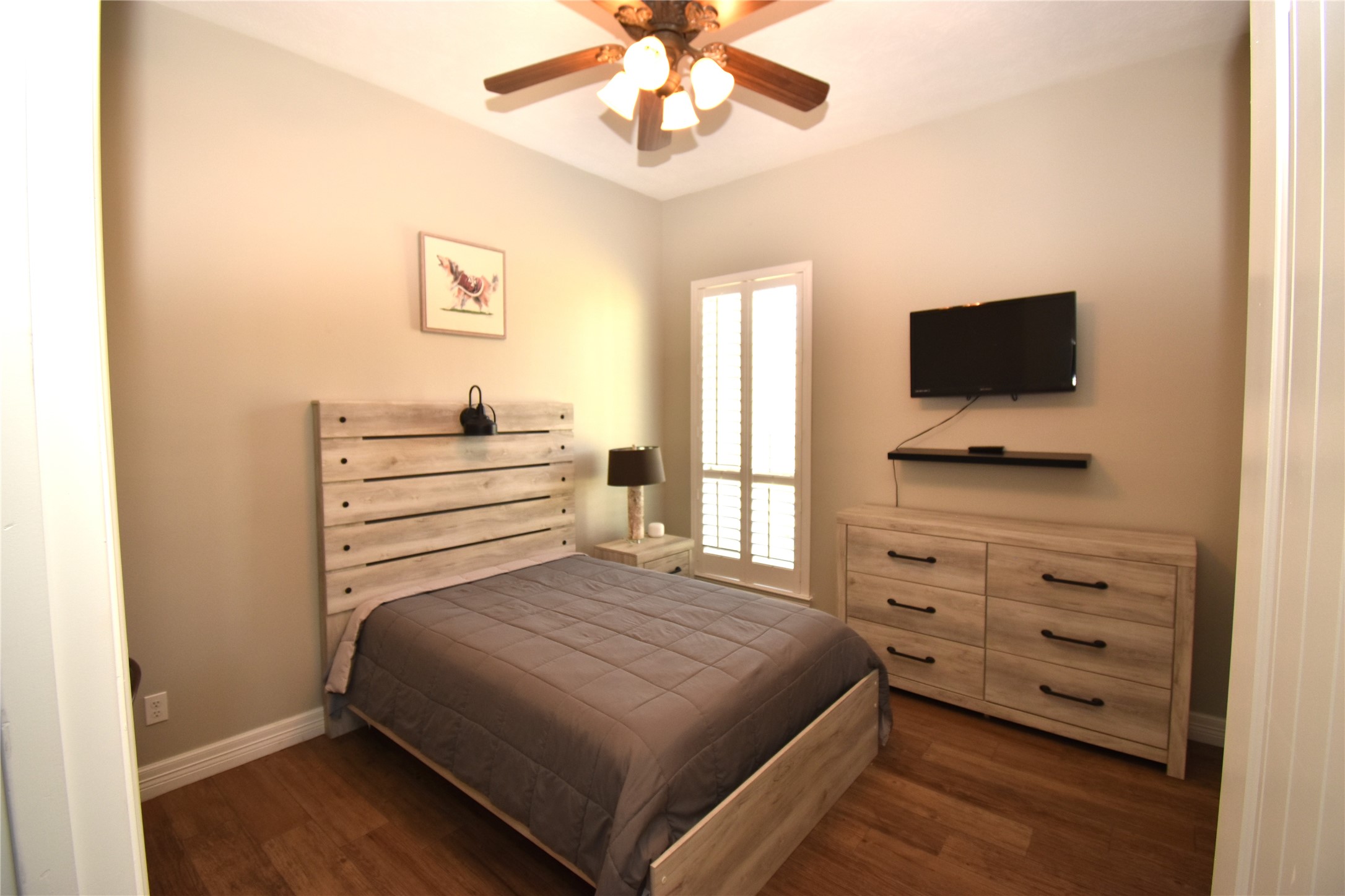 11620 Ridgecrest Beaumont, TX 77705 - Photo 13 of 20 a bedroom with a bed and a flat screen tv