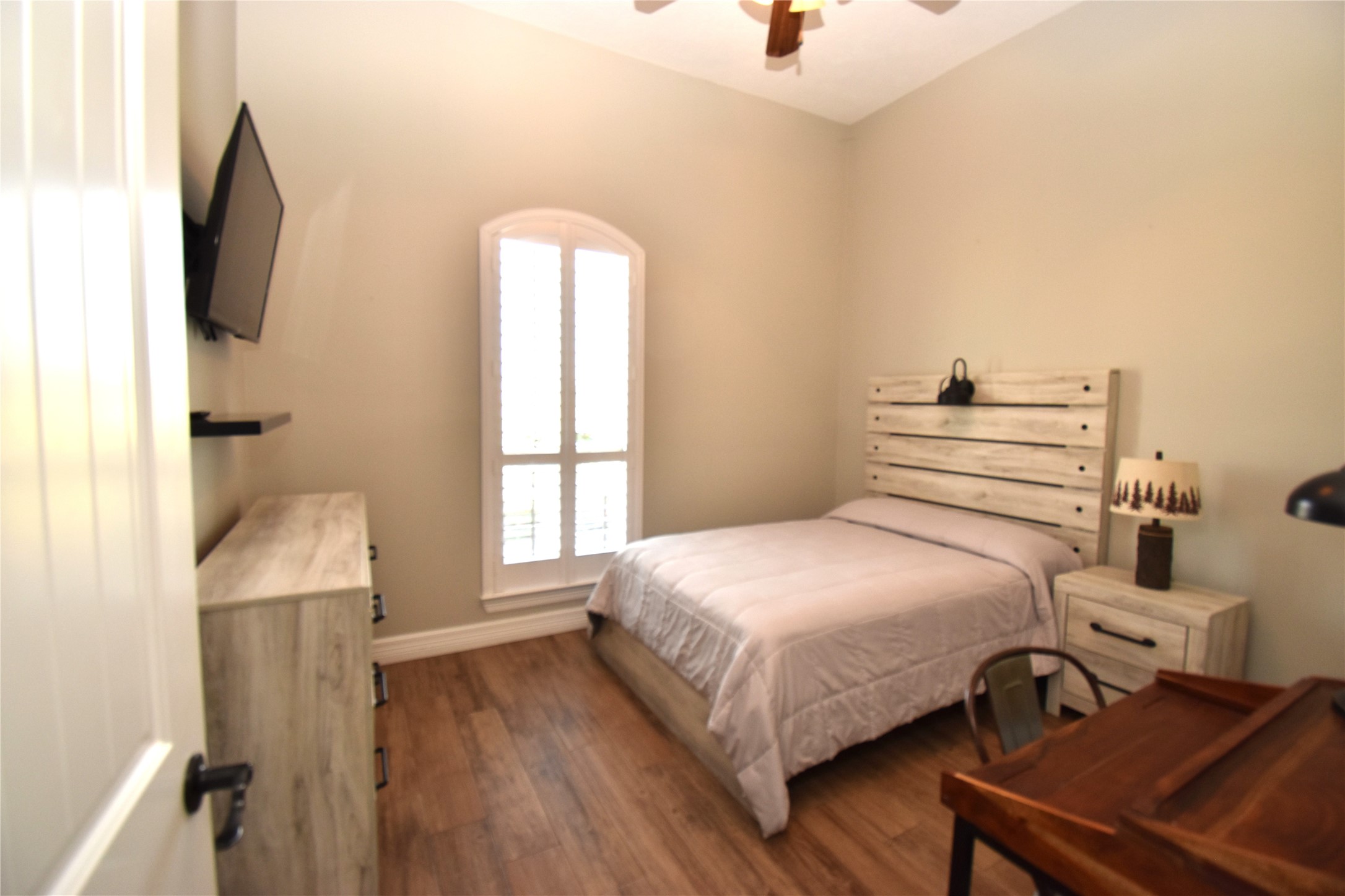 11620 Ridgecrest Beaumont, TX 77705 - Photo 14 of 20 a bedroom with a bed and large windows