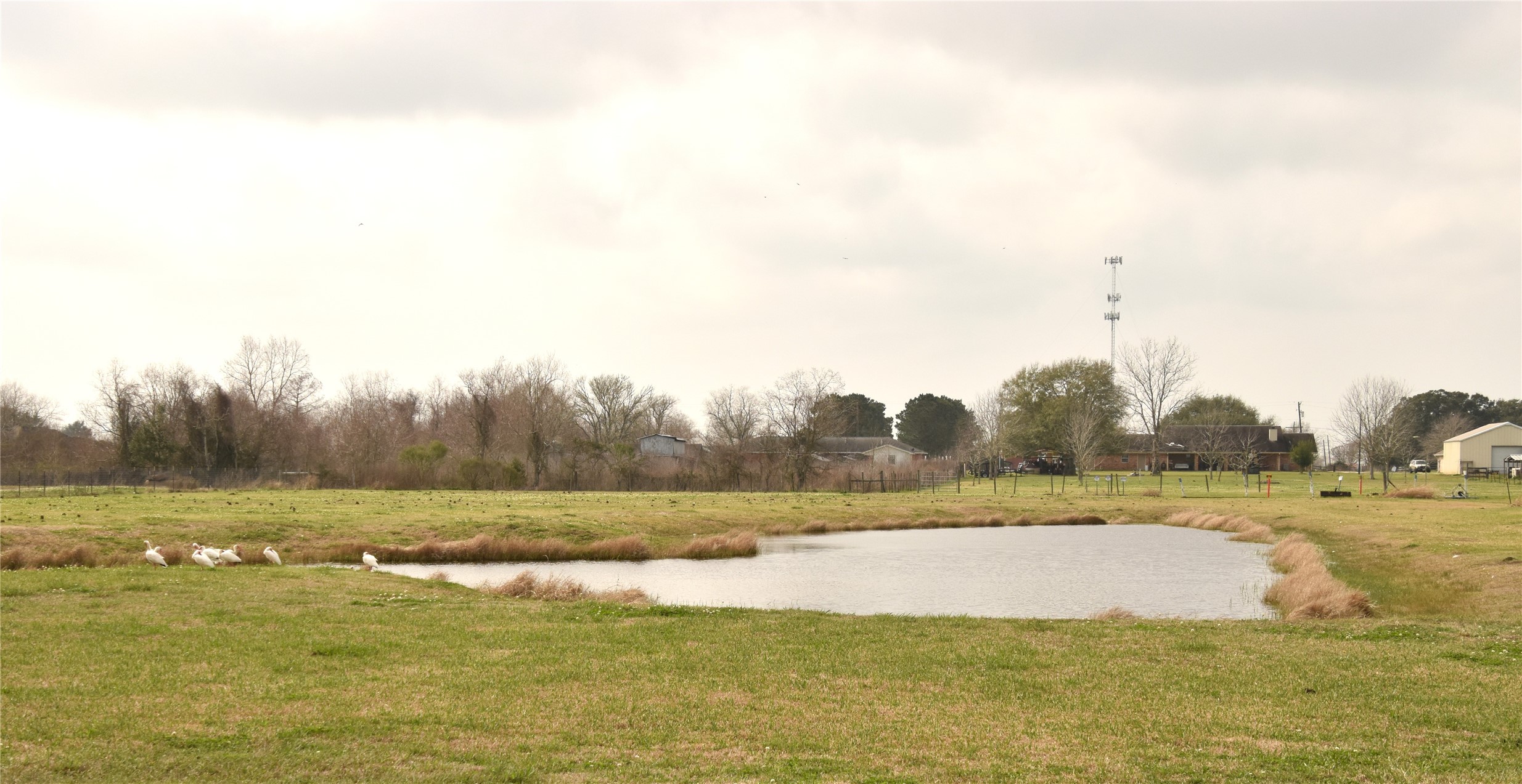 11620 Ridgecrest Beaumont, TX 77705 - Photo 19 of 20 a view of a lake with houses in the background