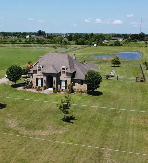 11620 Ridgecrest Beaumont, TX 77705 - Photo 20 of 20 a view of a lake with a house in the background