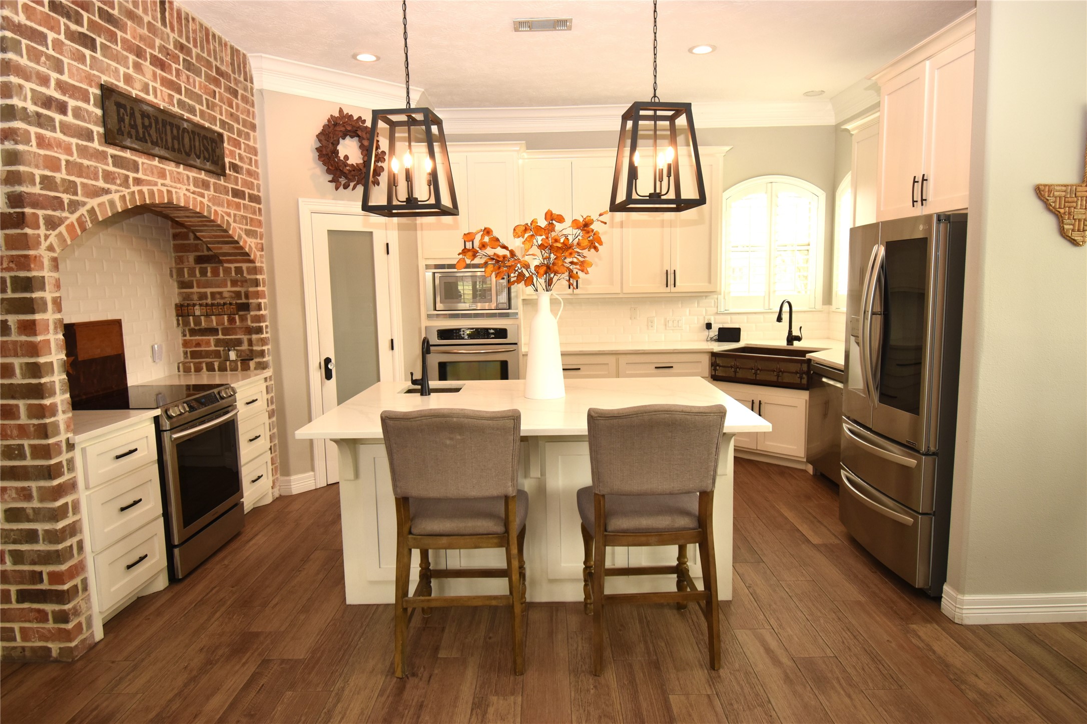 11620 Ridgecrest Beaumont, TX 77705 - Photo 6 of 20 a kitchen with stainless steel appliances a dining table chairs stove refrigerator and cabinets