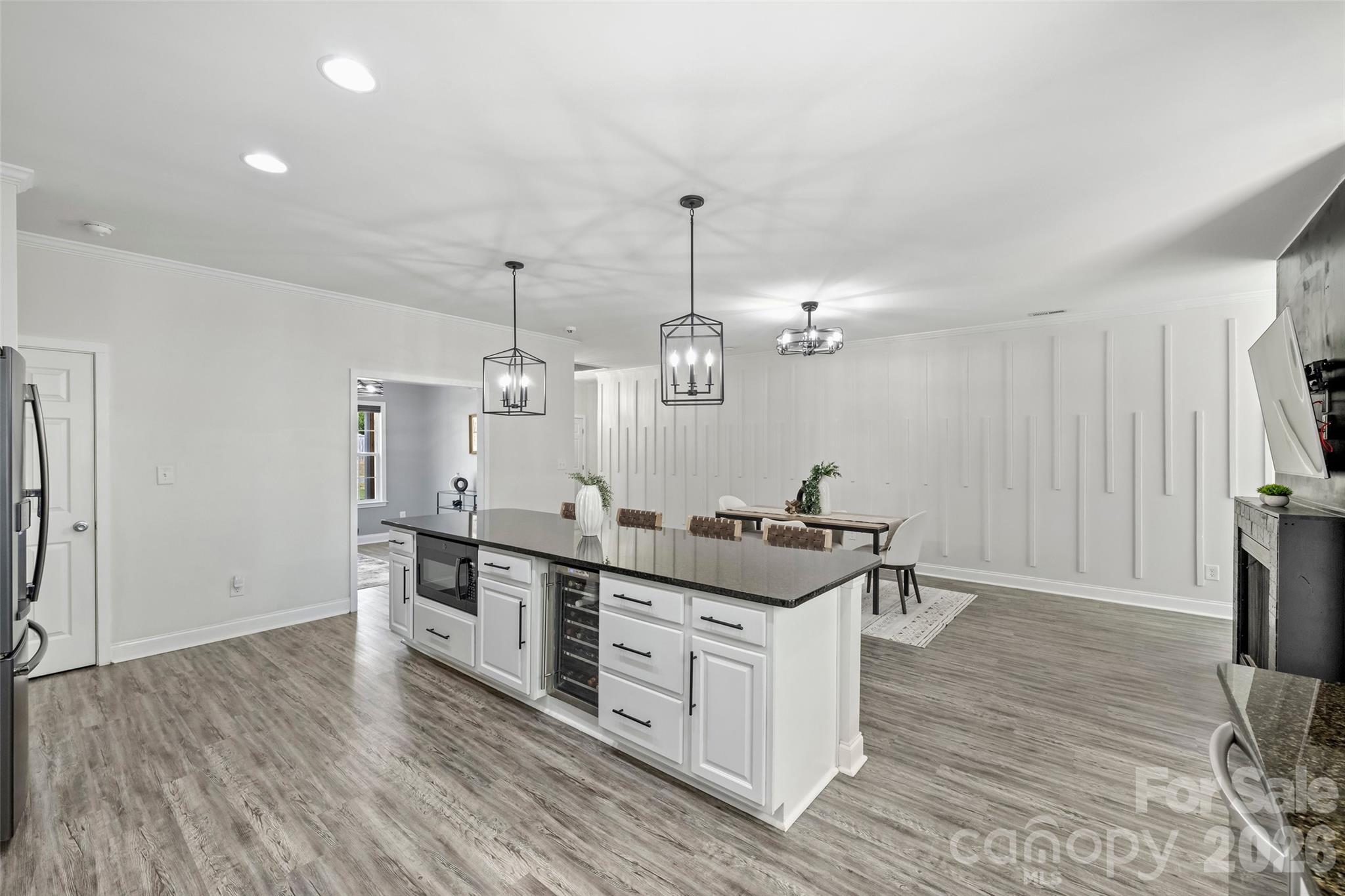 2500 Grayson Parkway Monroe, NC 28110 - Photo 12 of 41 a kitchen with stainless steel appliances a stove and wooden floor