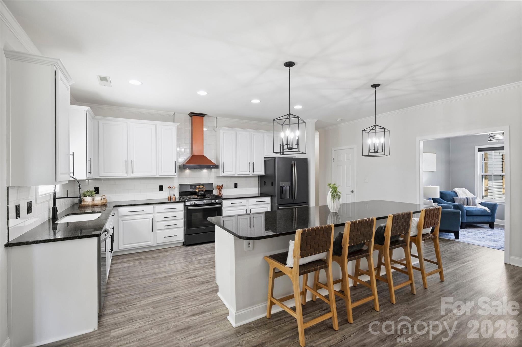 2500 Grayson Parkway Monroe, NC 28110 - Photo 13 of 41 a kitchen with stainless steel appliances kitchen island granite countertop a dining table chairs stove refrigerator and cabinets