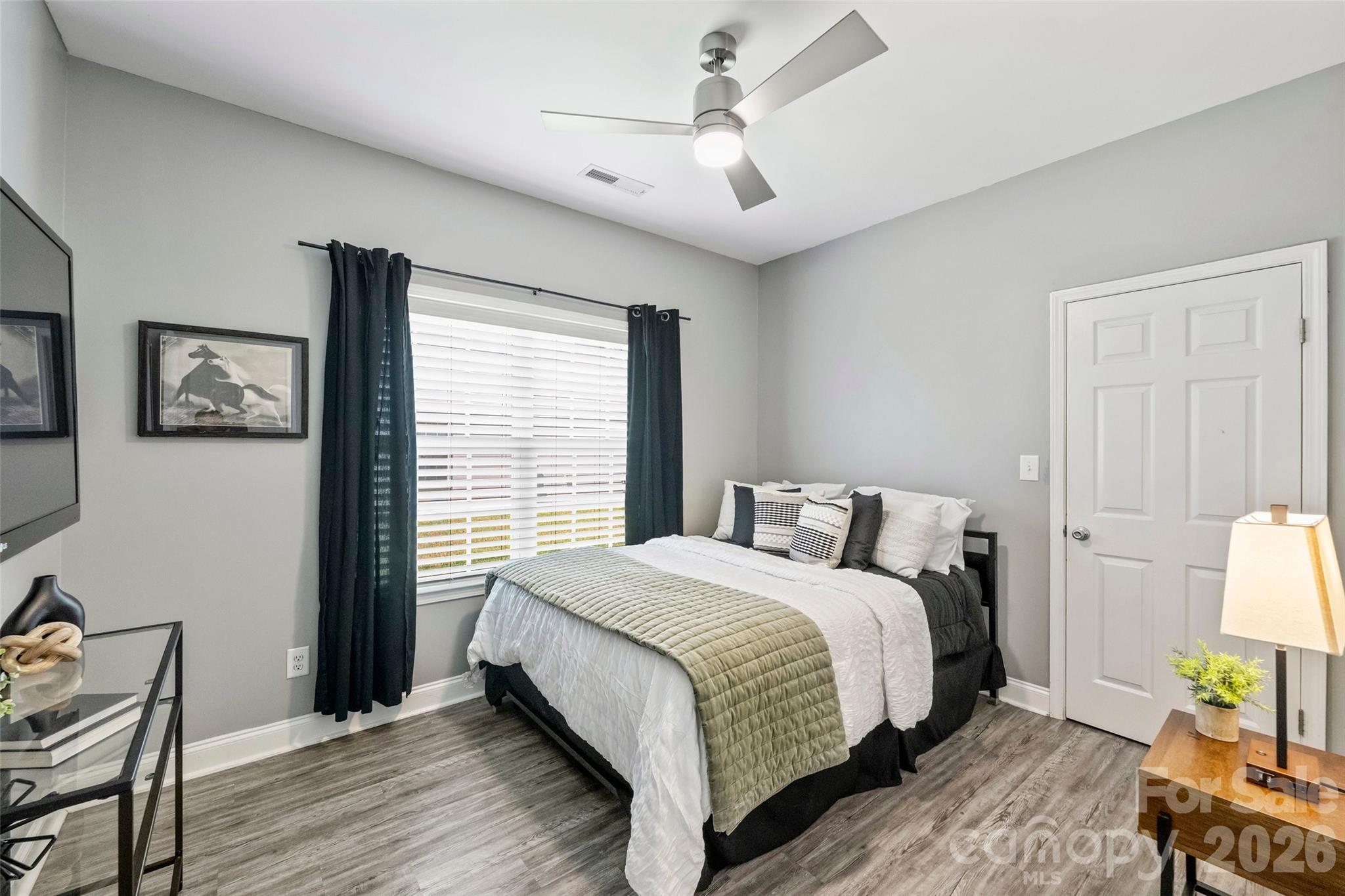 2500 Grayson Parkway Monroe, NC 28110 - Photo 25 of 41 a bedroom with a bed wooden floor and window