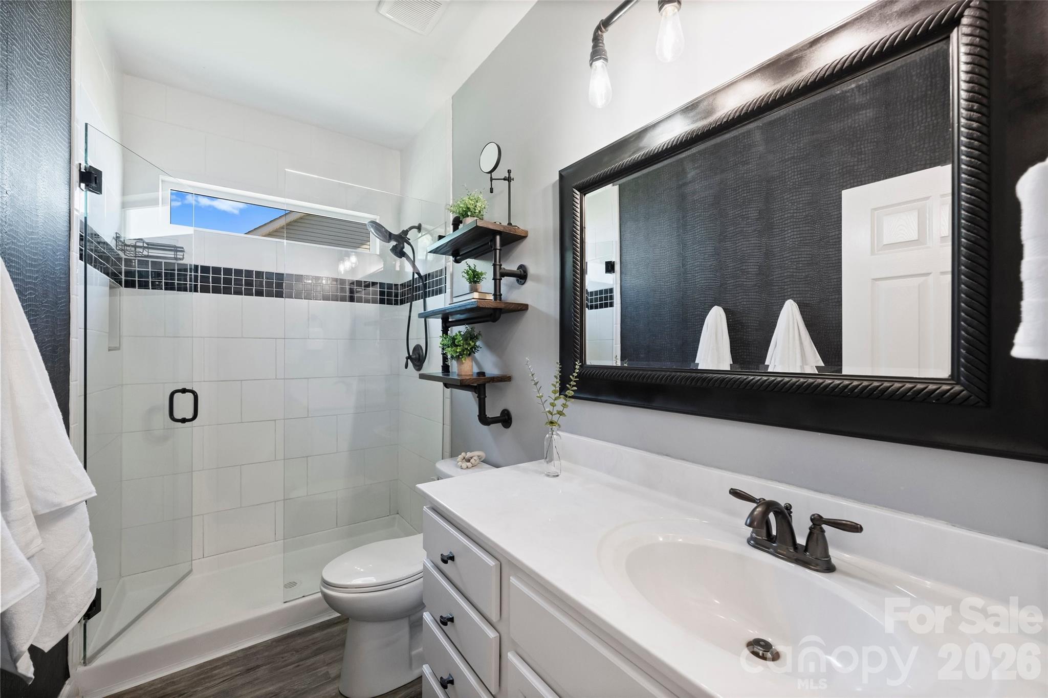2500 Grayson Parkway Monroe, NC 28110 - Photo 26 of 41 a bathroom with a sink a toilet and shower