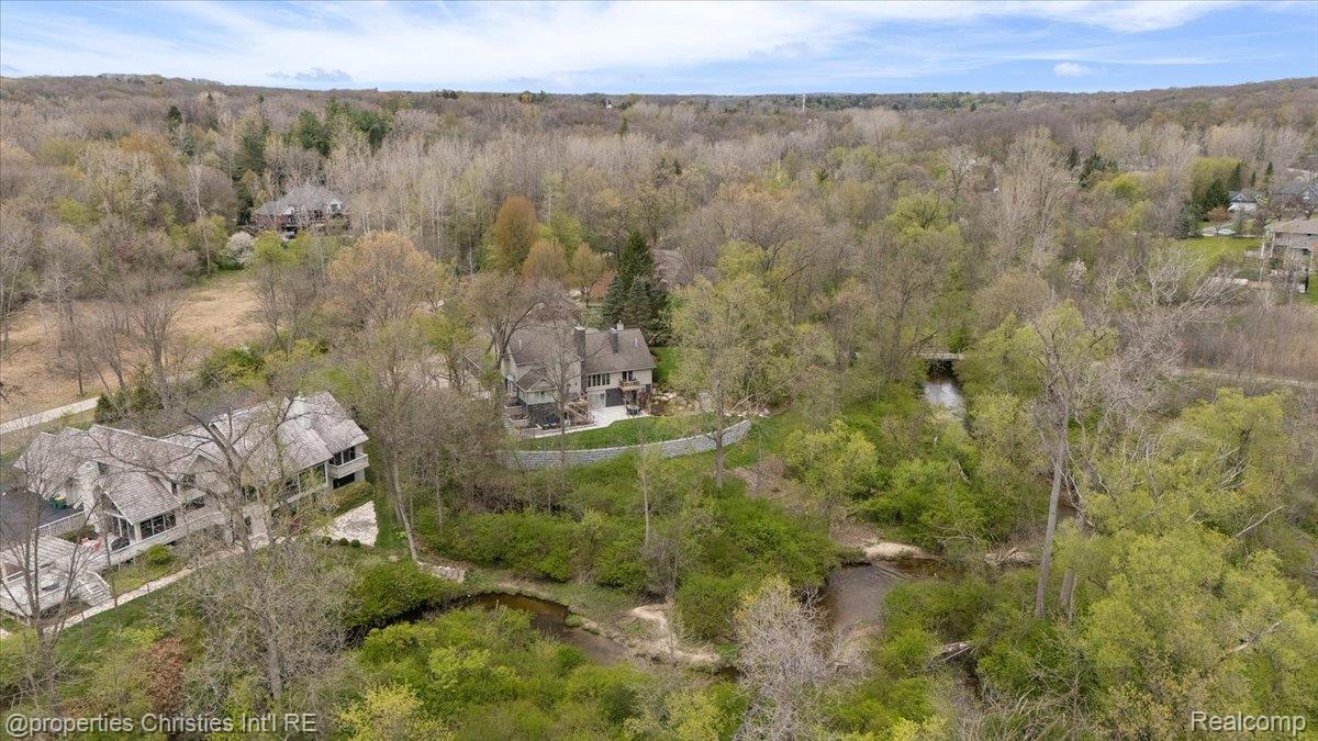 1071 Woodbridge Lane Rochester, MI 48306 - Photo 76 of 76 Aerial view of residential area featuring a heavily wooded area