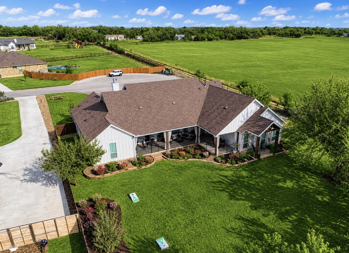 132 Huerta Road Florence, TX 76527 - Photo 37 of 38 an aerial view of a house with pool a yard and lake view