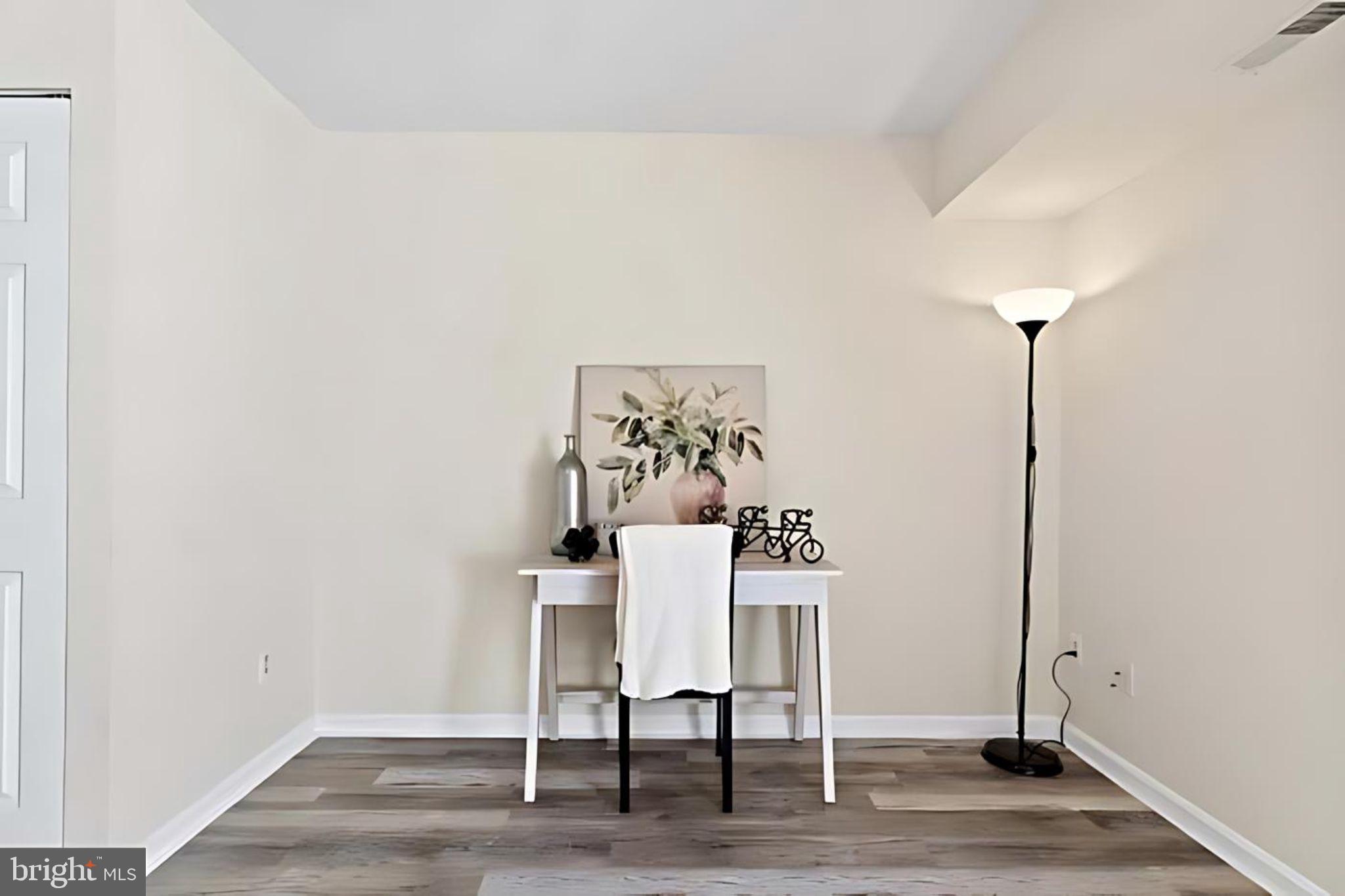107 St Charles Square Sterling, VA 20164 - Photo 11 of 27 a view of a room with a table and chairs