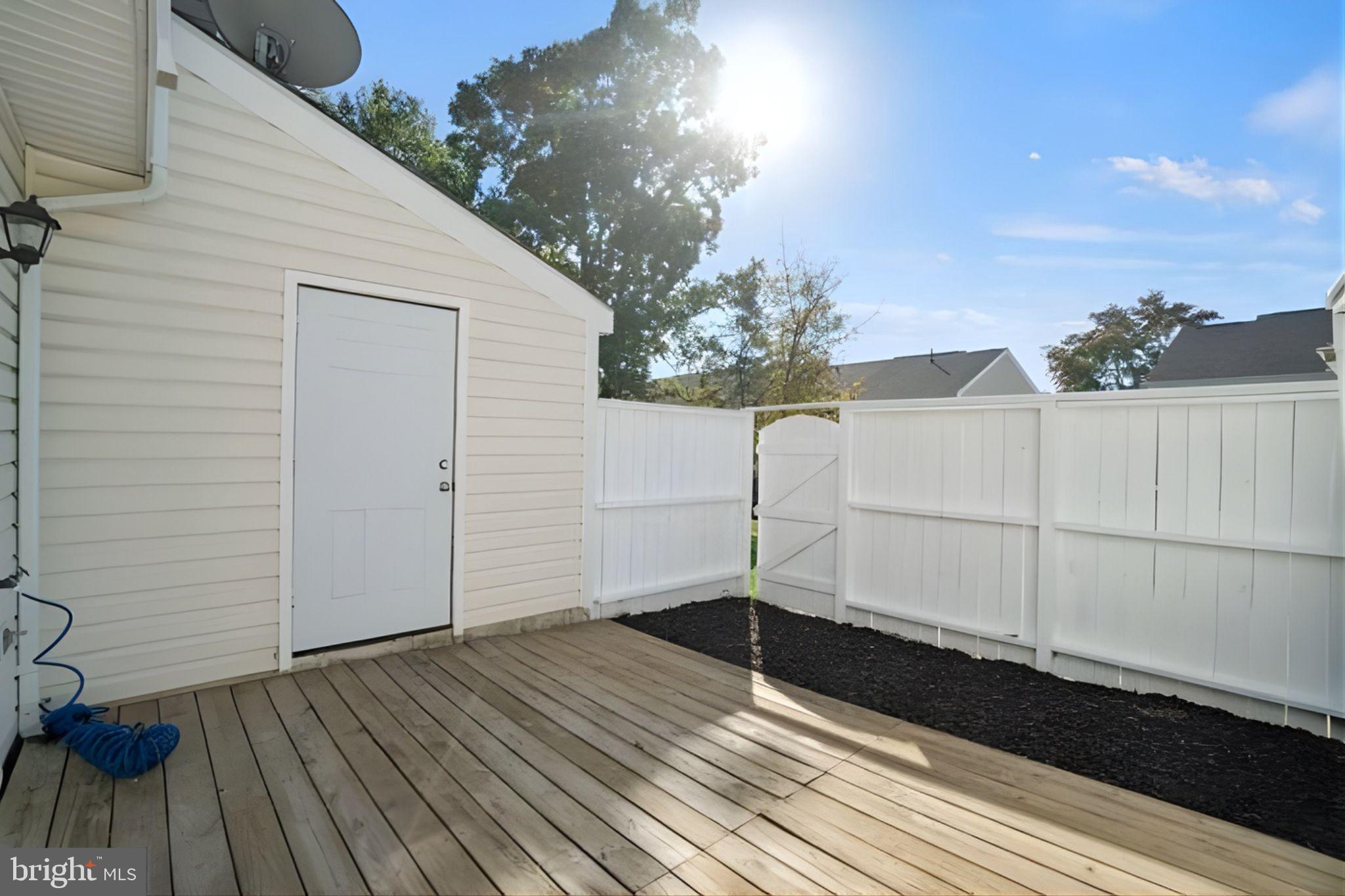 107 St Charles Square Sterling, VA 20164 - Photo 14 of 27 a view of a backyard of the house