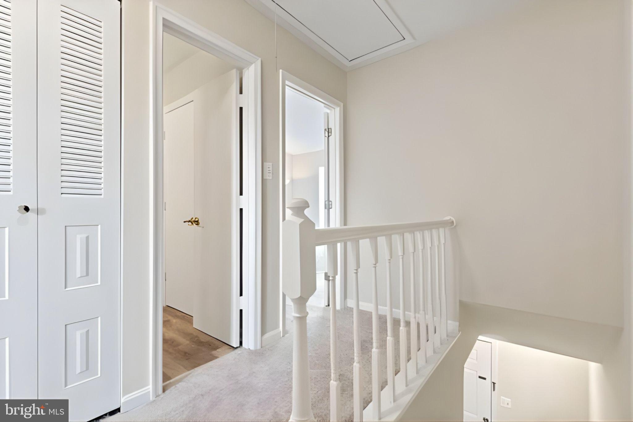 107 St Charles Square Sterling, VA 20164 - Photo 15 of 27 a view of a hallway with wooden floor and entryway