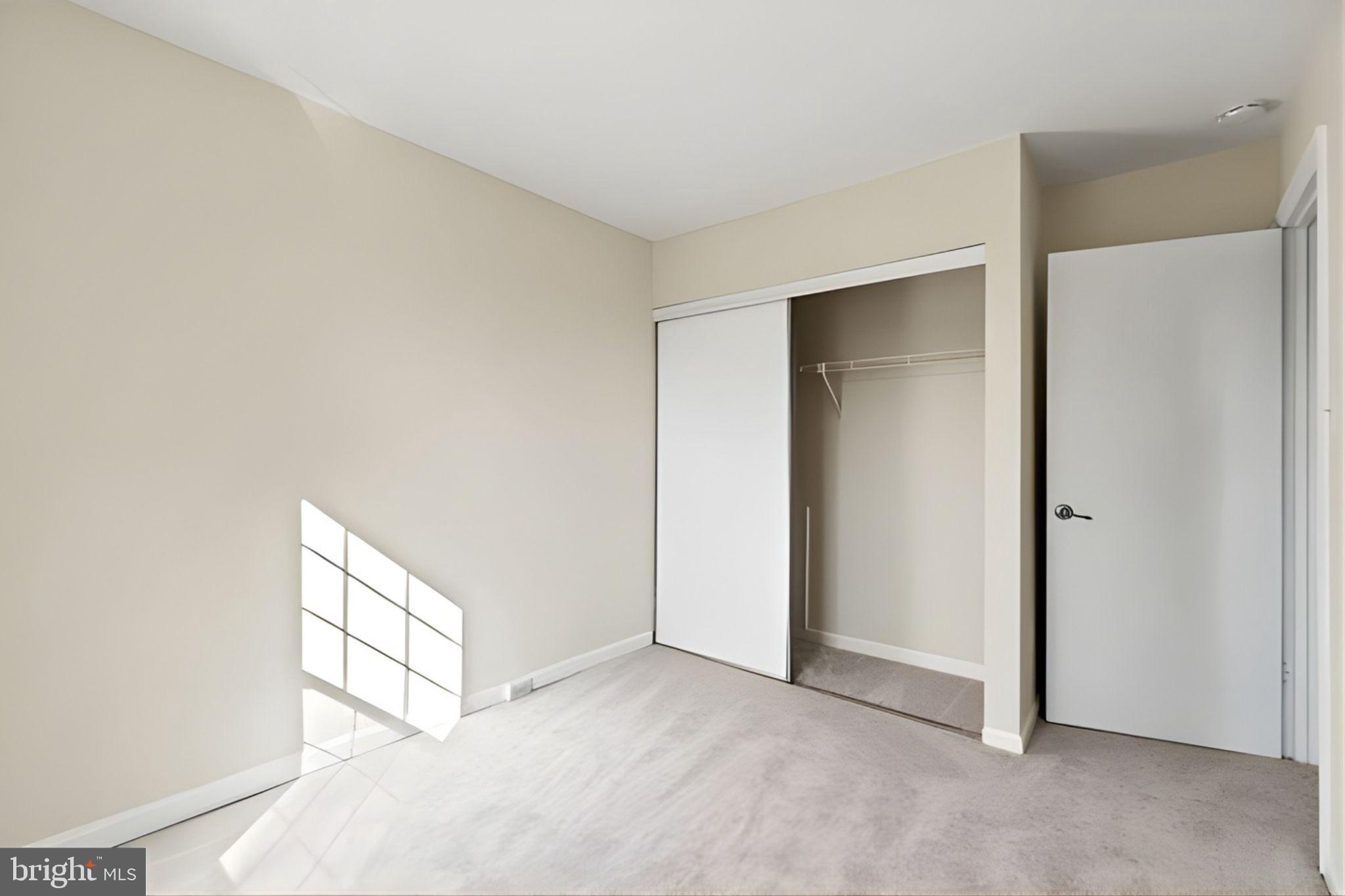 107 St Charles Square Sterling, VA 20164 - Photo 23 of 27 a view of an empty room and window