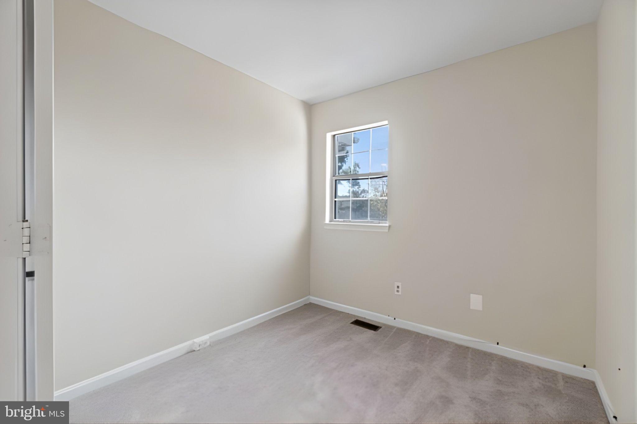 107 St Charles Square Sterling, VA 20164 - Photo 25 of 27 a view of an empty room with a window