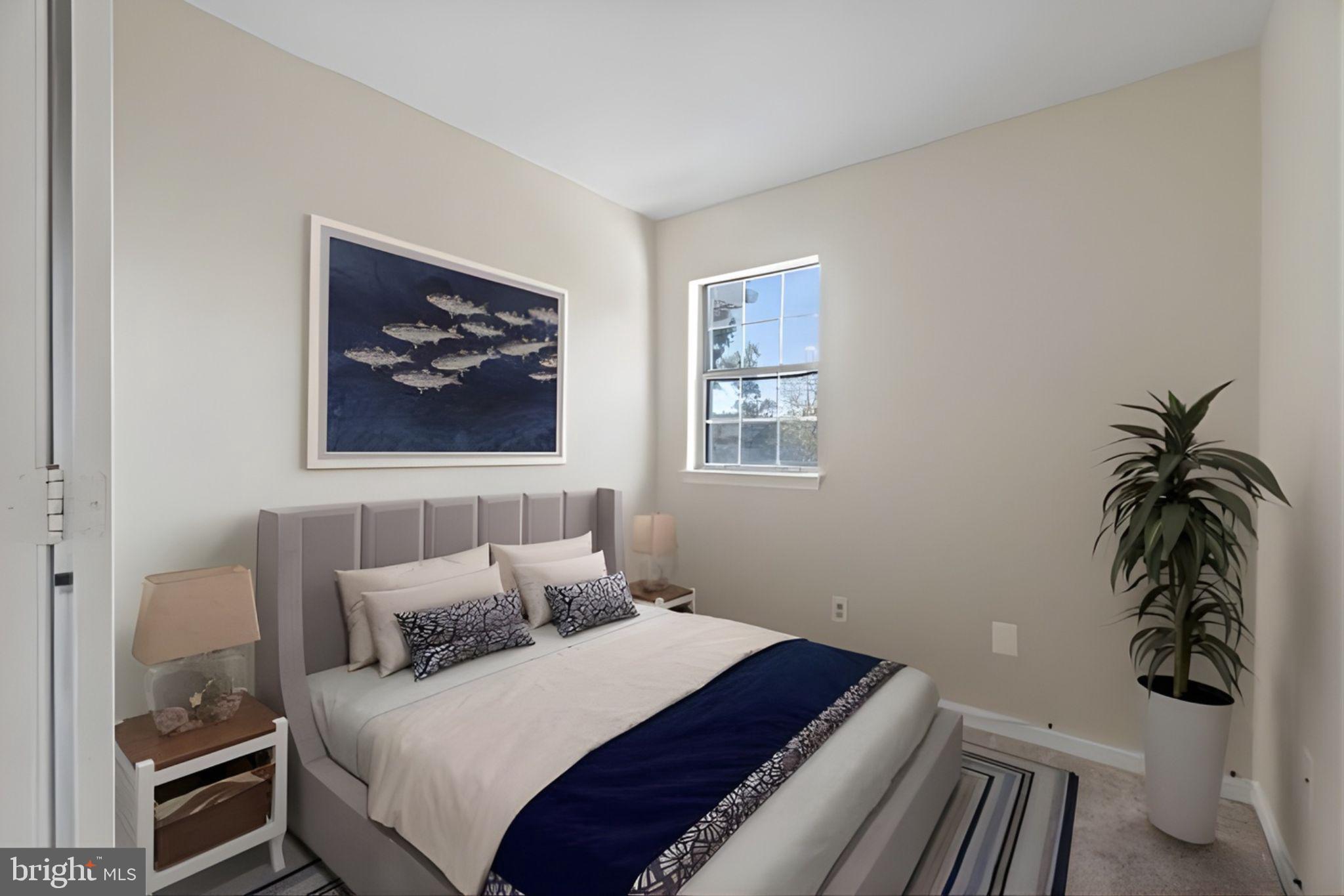 107 St Charles Square Sterling, VA 20164 - Photo 26 of 27 a bedroom with a bed and a window