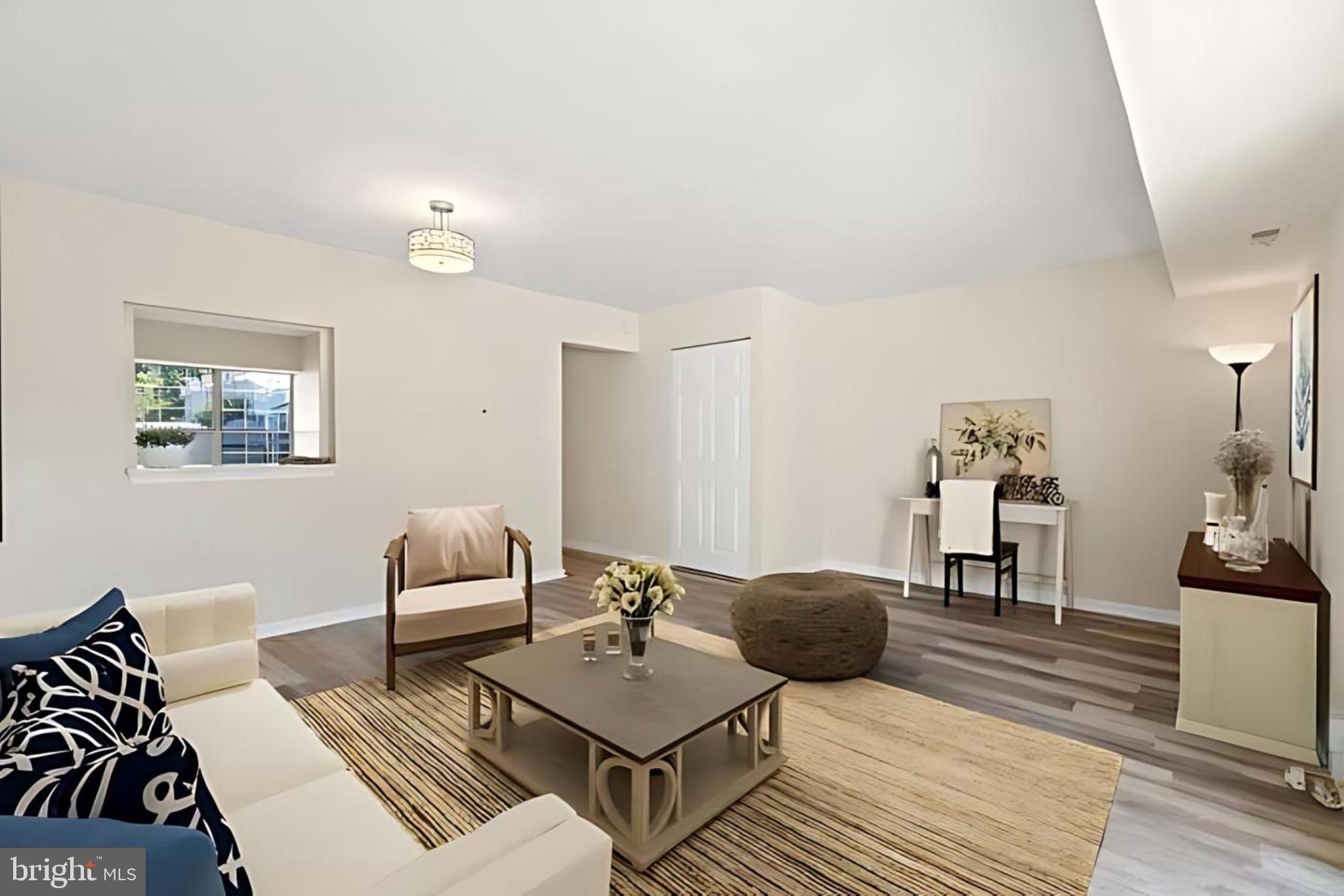 107 St Charles Square Sterling, VA 20164 - Photo 10 of 27 a living room with furniture and wooden floor
