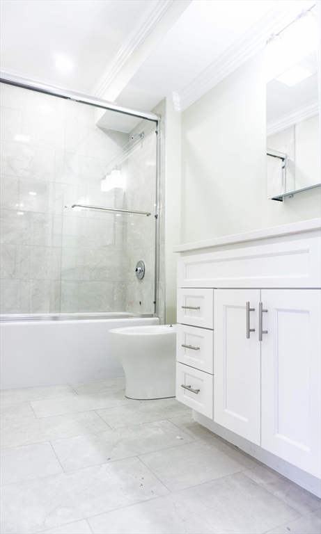 2017 Commonwealth Avenue, Unit 6 Boston, MA 02135 - Photo 3 of 3 a bathroom with a bathtub and a shower