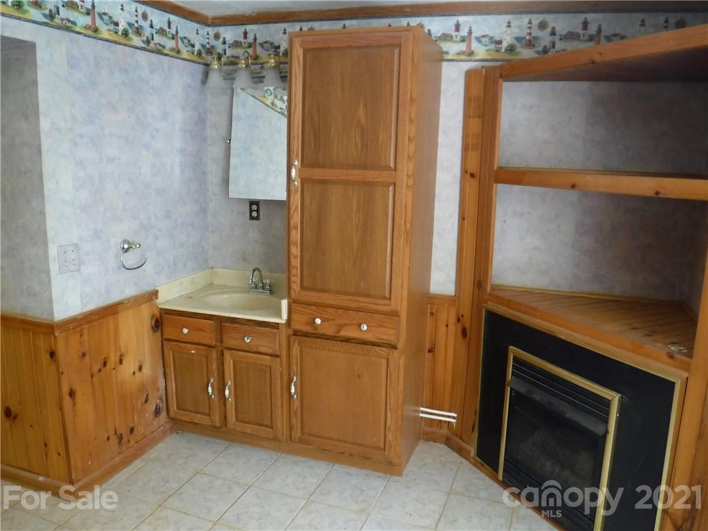 4221 Maple Creek Road Rutherfordton, NC 28139 - Photo 39 of 48 a bathroom with a sink and a mirror