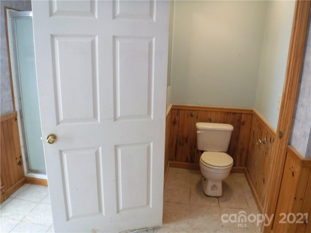 4221 Maple Creek Road Rutherfordton, NC 28139 - Photo 40 of 48 a white toilet sitting next to a sink