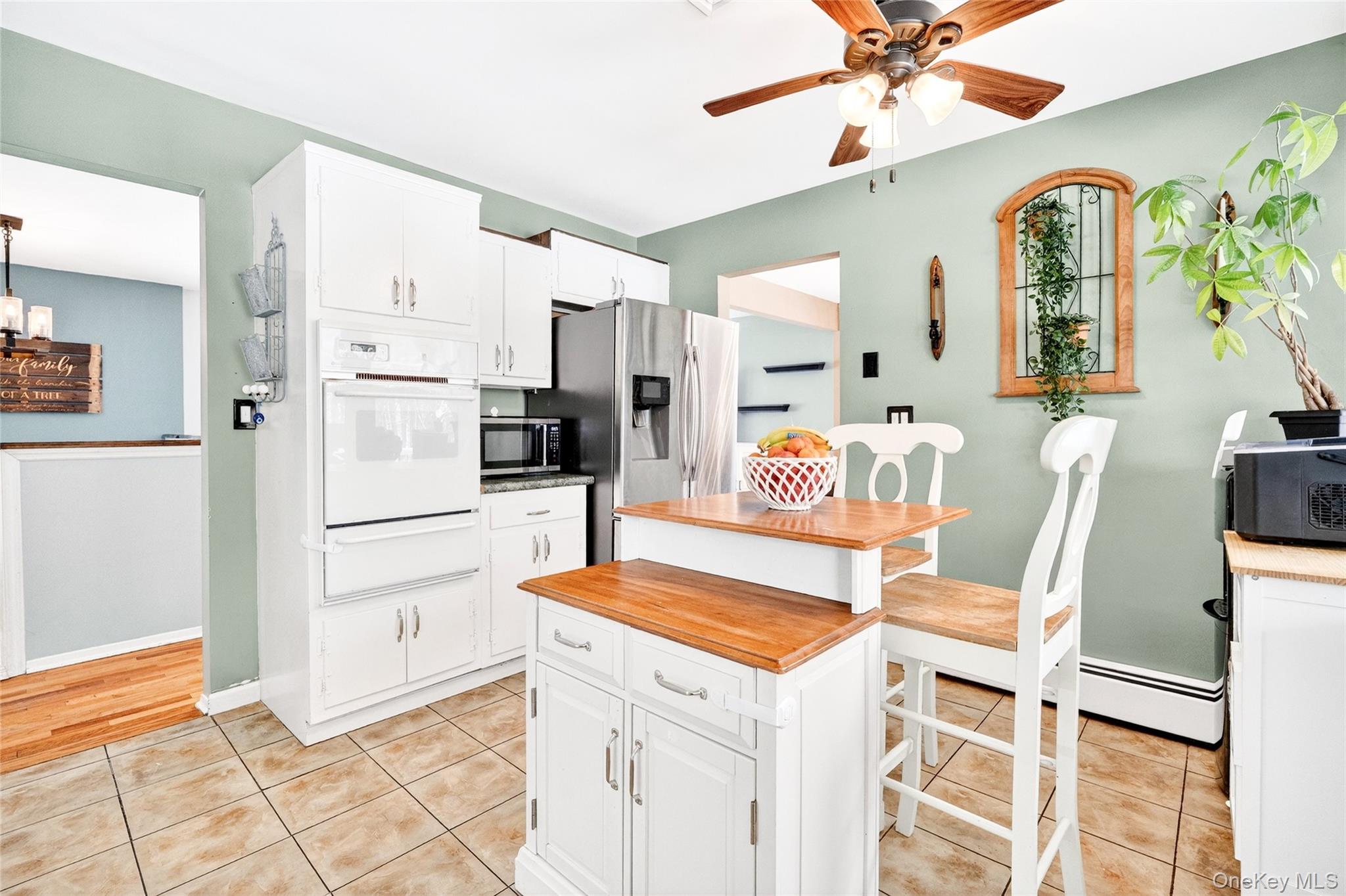 125 Cedar Flats Road Stony Point, NY 10980 - Photo 14 of 48 a kitchen with stainless steel appliances kitchen island granite countertop a refrigerator and a stove