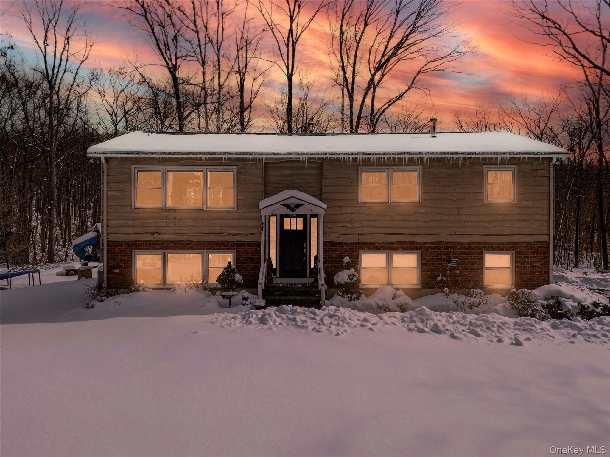 125 Cedar Flats Road Stony Point, NY 10980 - Photo 2 of 48 a front view of a house with a yard and garage