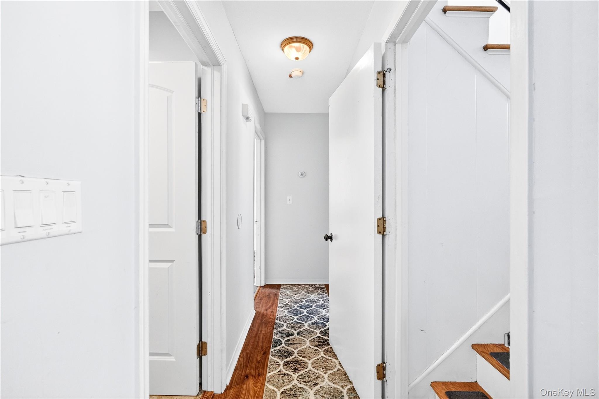 125 Cedar Flats Road Stony Point, NY 10980 - Photo 26 of 48 a view of hallway with stairs and wooden floor