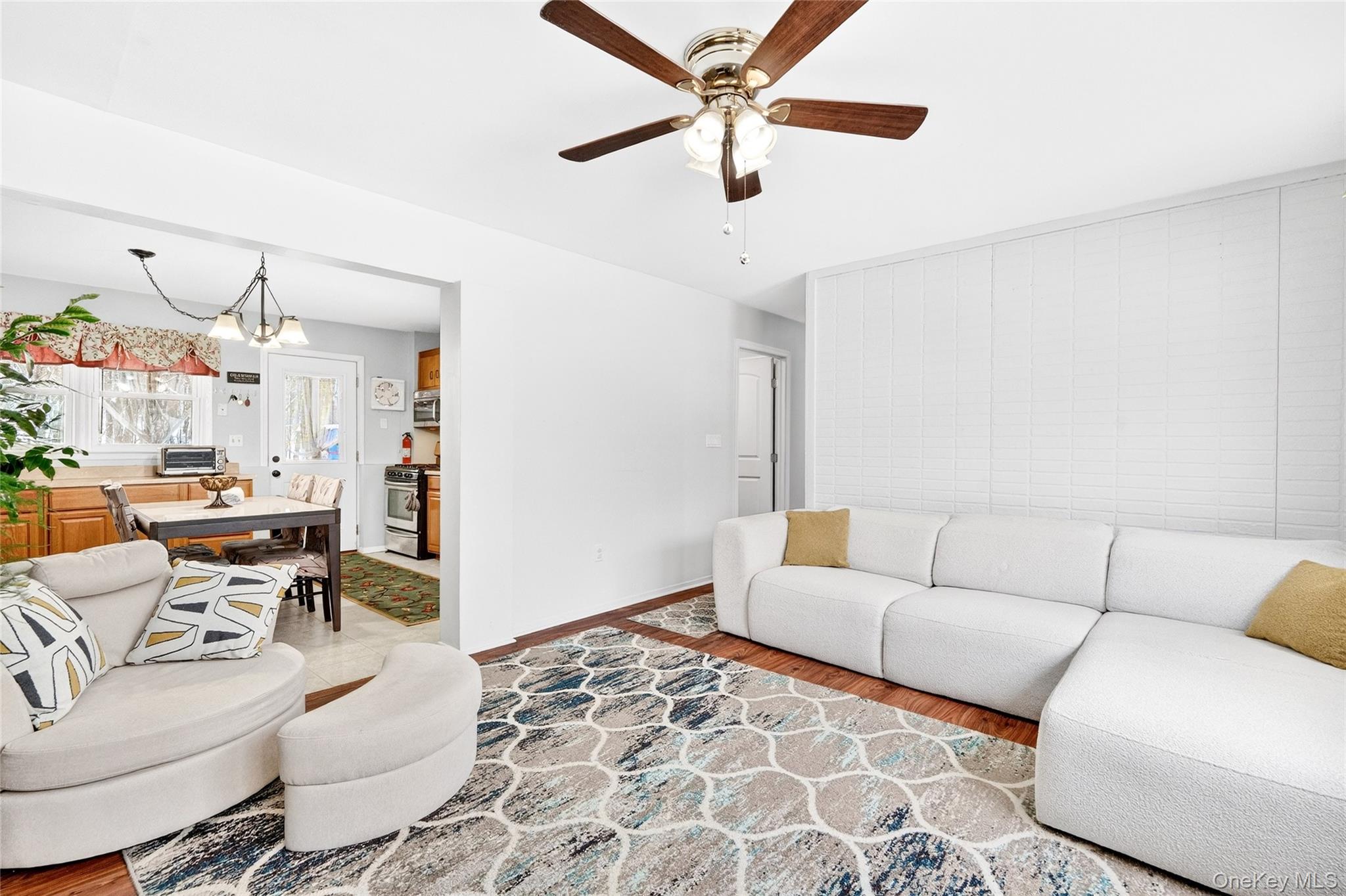 125 Cedar Flats Road Stony Point, NY 10980 - Photo 28 of 48 a living room with furniture and a chandelier
