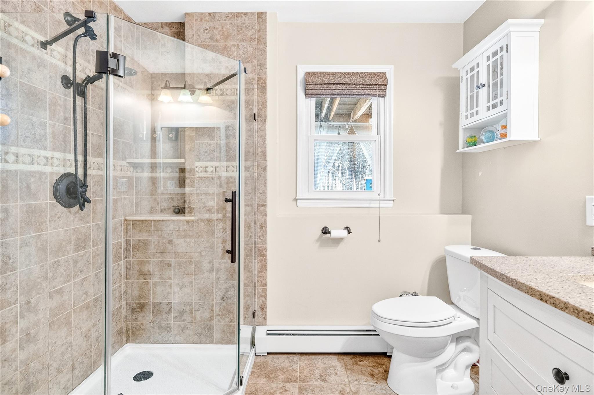 125 Cedar Flats Road Stony Point, NY 10980 - Photo 32 of 48 a bathroom with a granite countertop shower a toilet and a sink