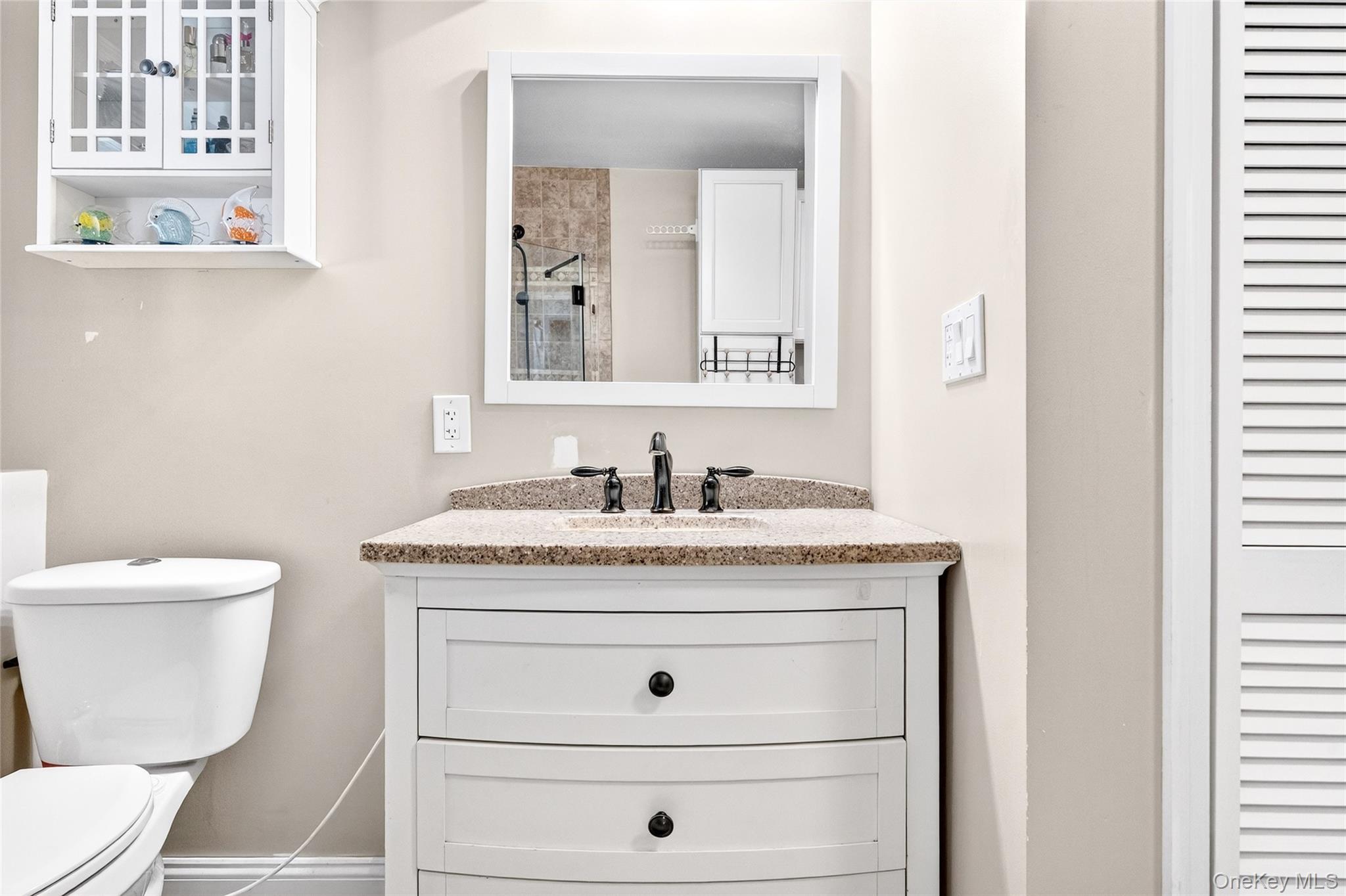 125 Cedar Flats Road Stony Point, NY 10980 - Photo 33 of 48 a bathroom with a granite countertop toilet sink and mirror