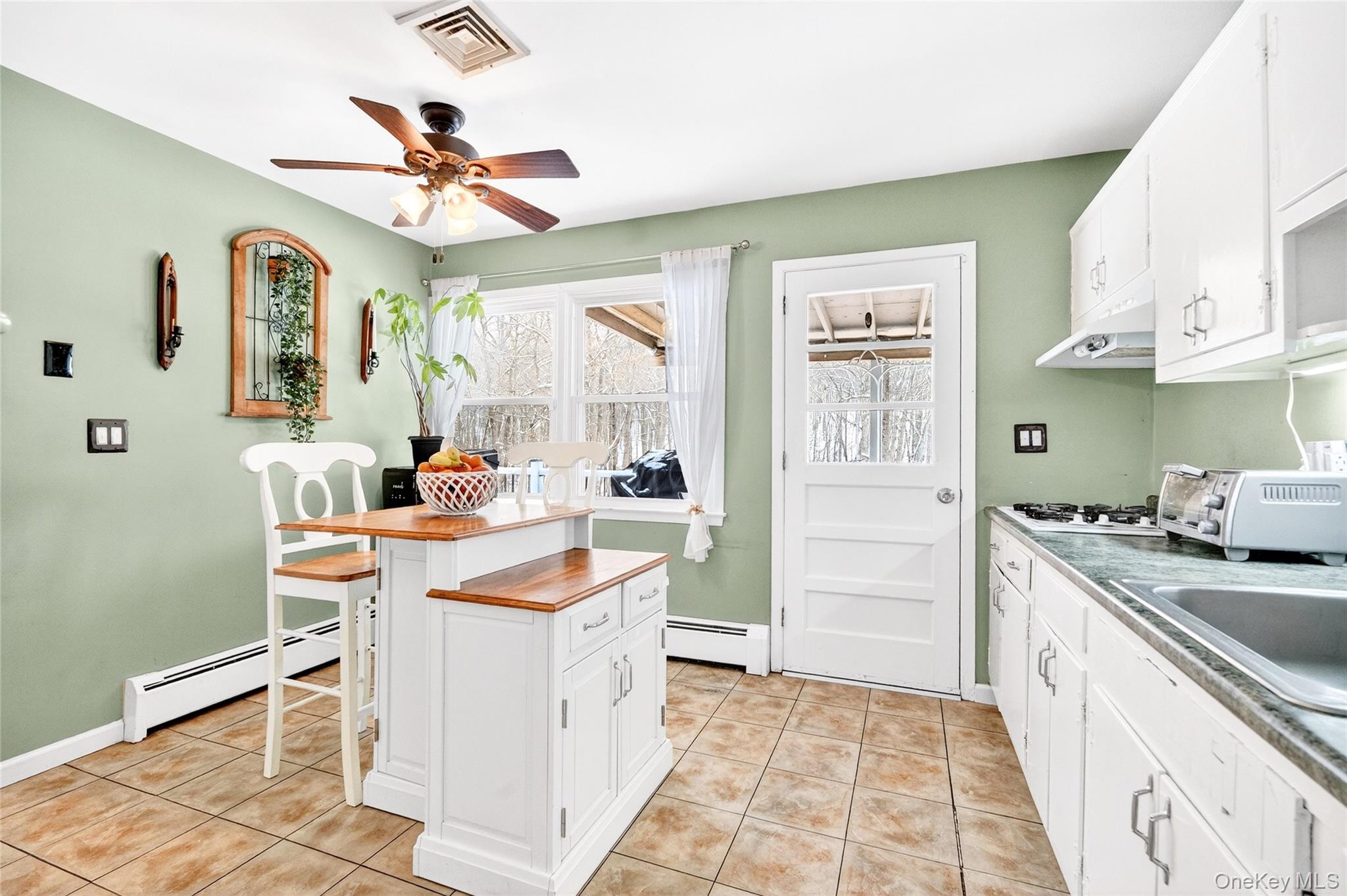 125 Cedar Flats Road Stony Point, NY 10980 - Photo 10 of 48 a kitchen with a stove a sink and a refrigerator