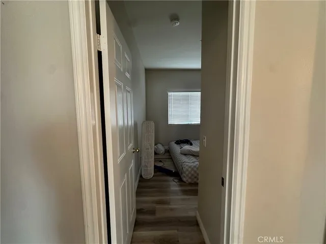 a bedroom with a bed and a closet