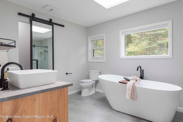 a living room with a couch and a large window