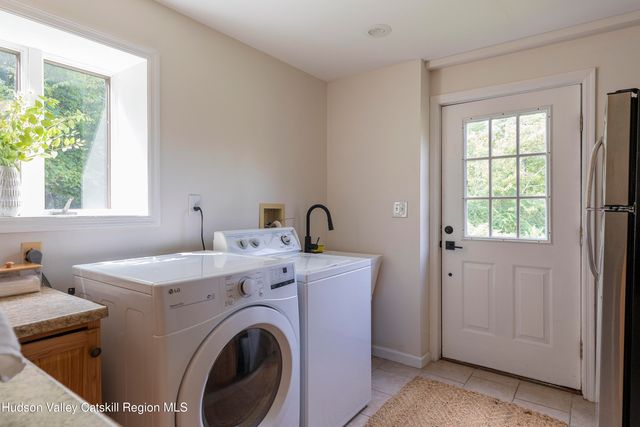 a view of livingroom with washer and dryer