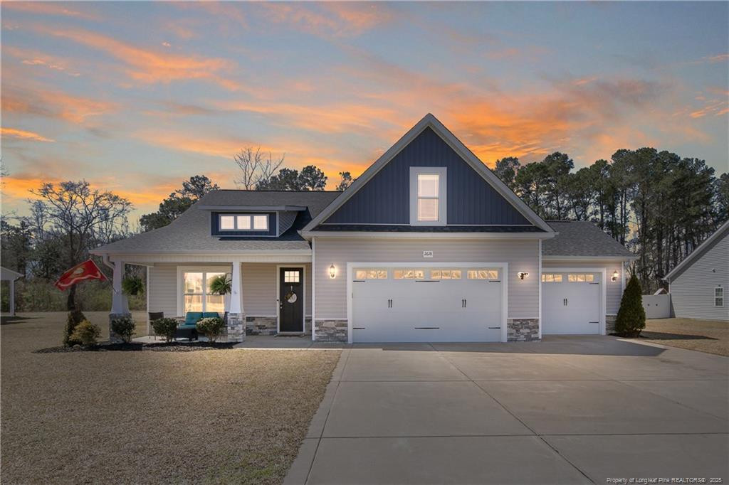 2628 Riddle Farm Road Fayetteville, NC 28306 - Photo 1 of 50 a view of a house with a yard and garage