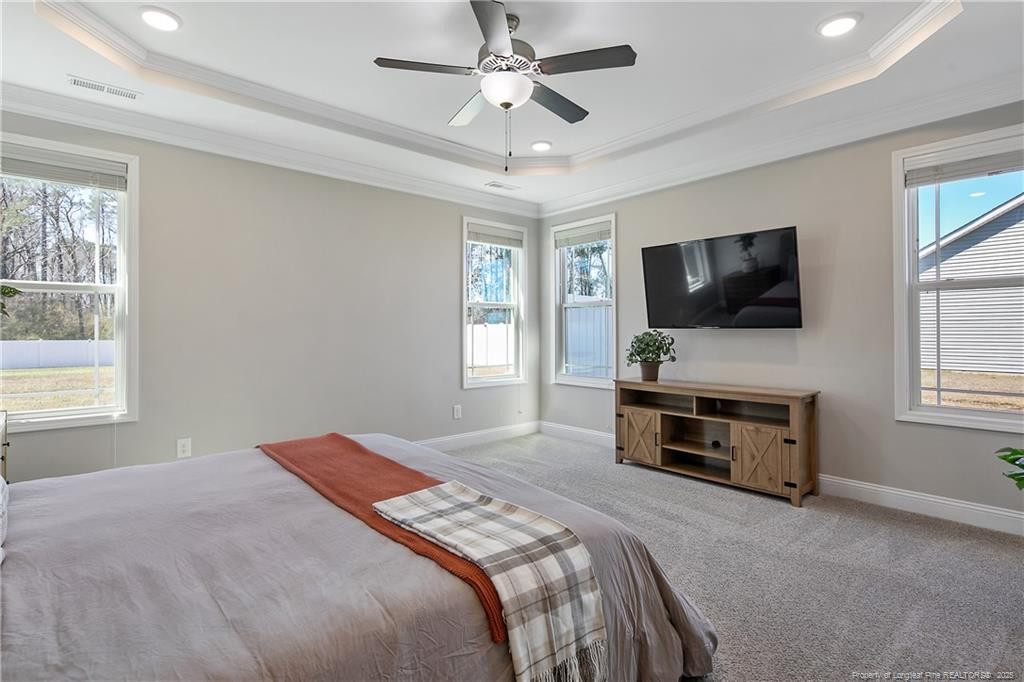 2628 Riddle Farm Road Fayetteville, NC 28306 - Photo 25 of 50 a bedroom with a bed and a flat screen tv