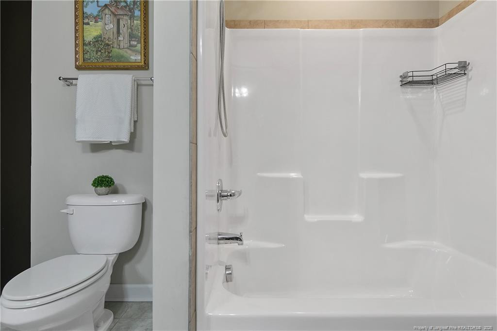 2628 Riddle Farm Road Fayetteville, NC 28306 - Photo 40 of 50 a bathroom with a toilet and a shower